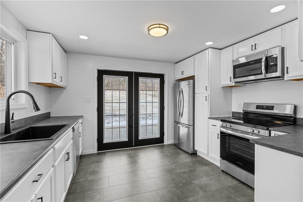 269 Derbytown Road Latrobe, PA 15650 - Photo 9 of 32 Kitchen with french doors. View is amazing.