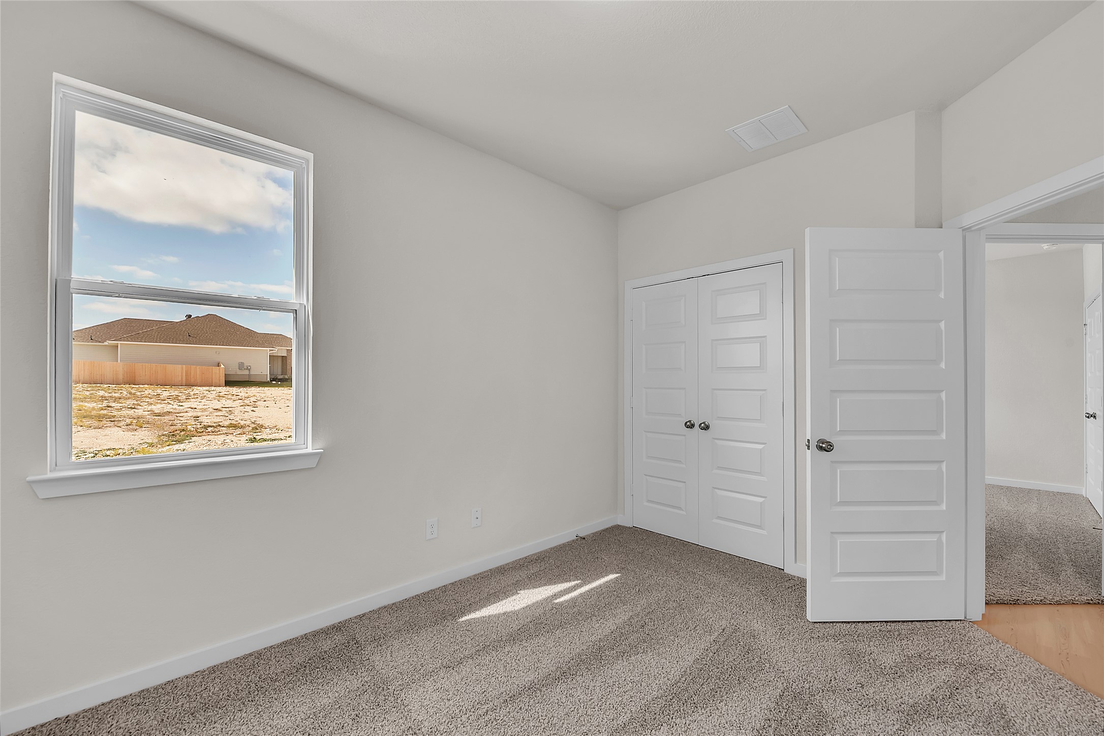 308 Boatright Boulevard Jarrell, TX 76537 - Photo 9 of 31 Unfurnished bedroom with light carpet and a closet
