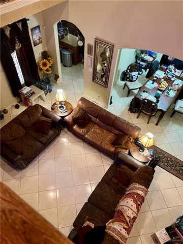 a bed sitting in a bedroom next to a computer on a desk