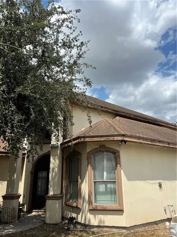 a view of a house with a small yard