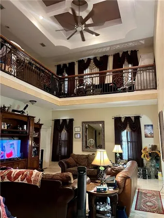 a living room with furniture gym equipment and a fireplace