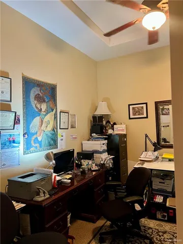 a work room with furniture and wooden floor
