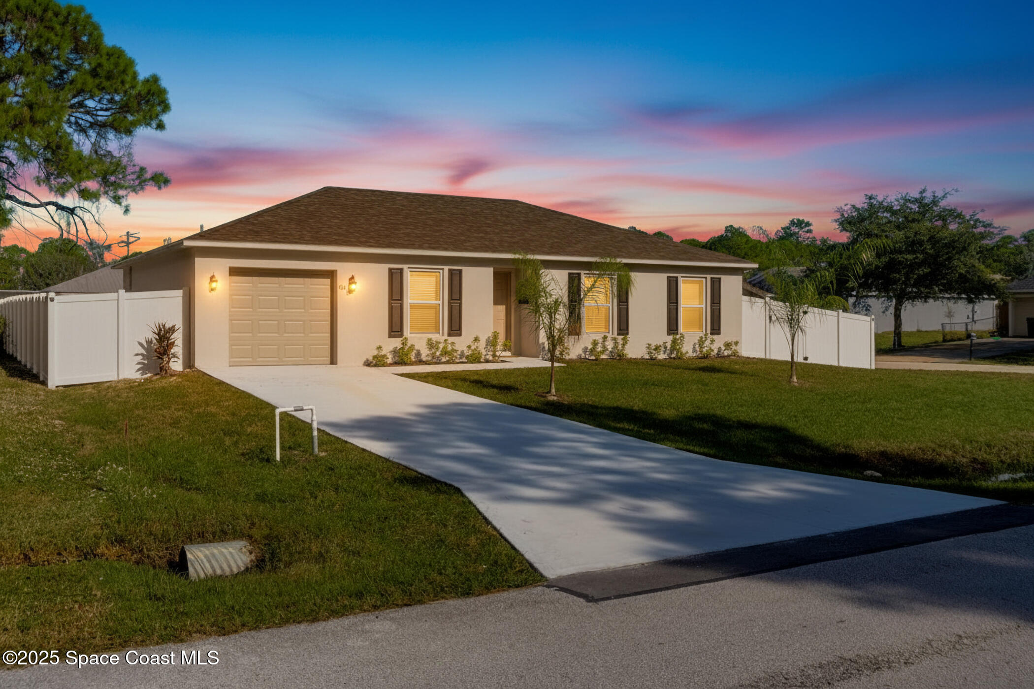 511 Trumpet Street Southwest Palm Bay, FL 32908 - Photo 1 of 43 a front view of a house with a yard