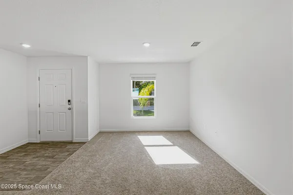 an empty room with windows