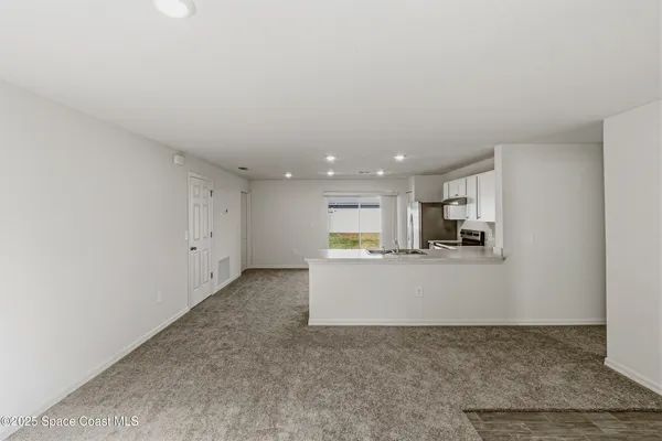 a view of kitchen and kitchen with sink