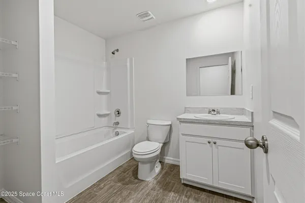 a bathroom with a sink a toilet and a bathtub