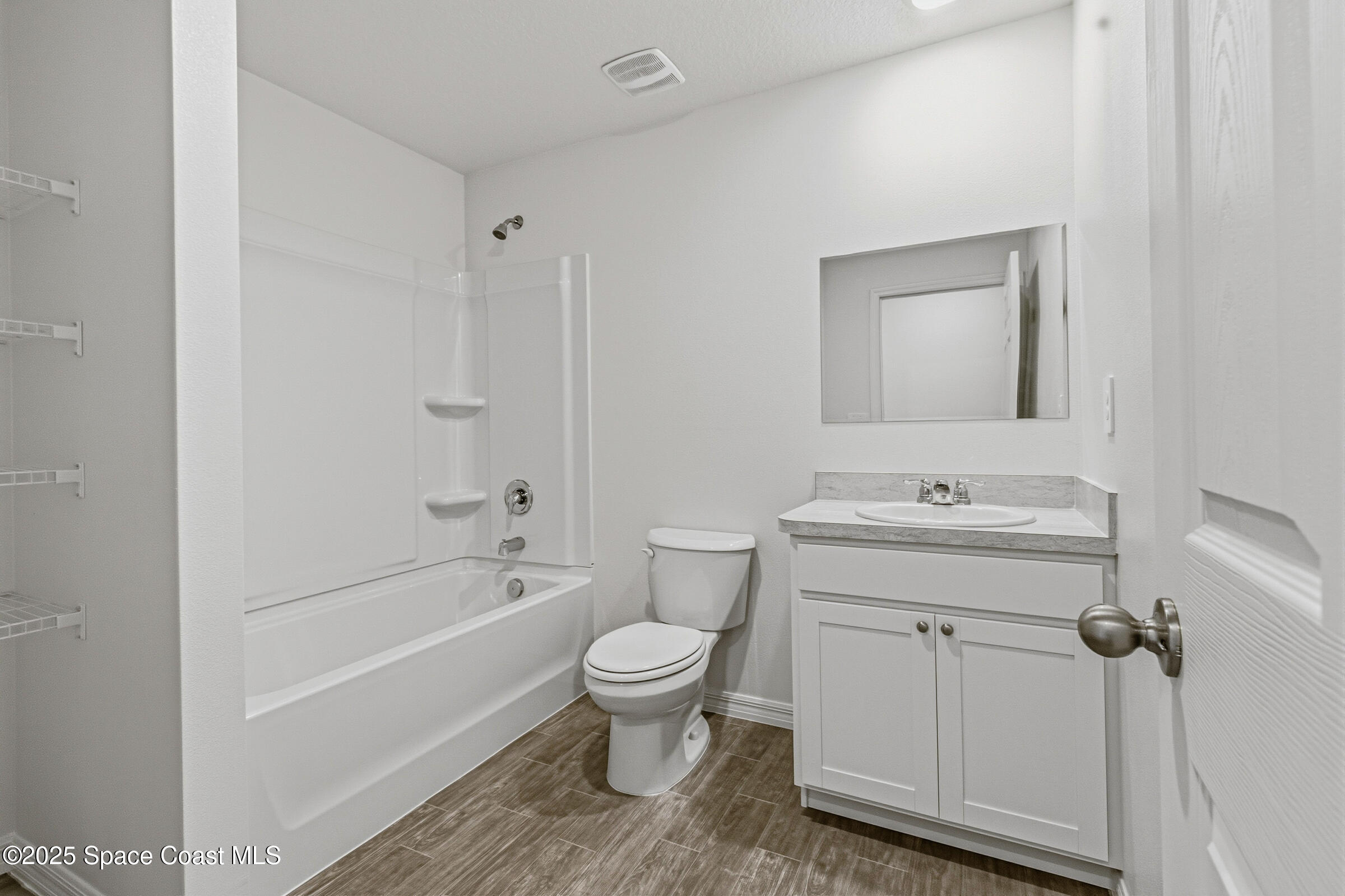 511 Trumpet Street Southwest Palm Bay, FL 32908 - Photo 20 of 43 a bathroom with a sink a toilet and a bathtub