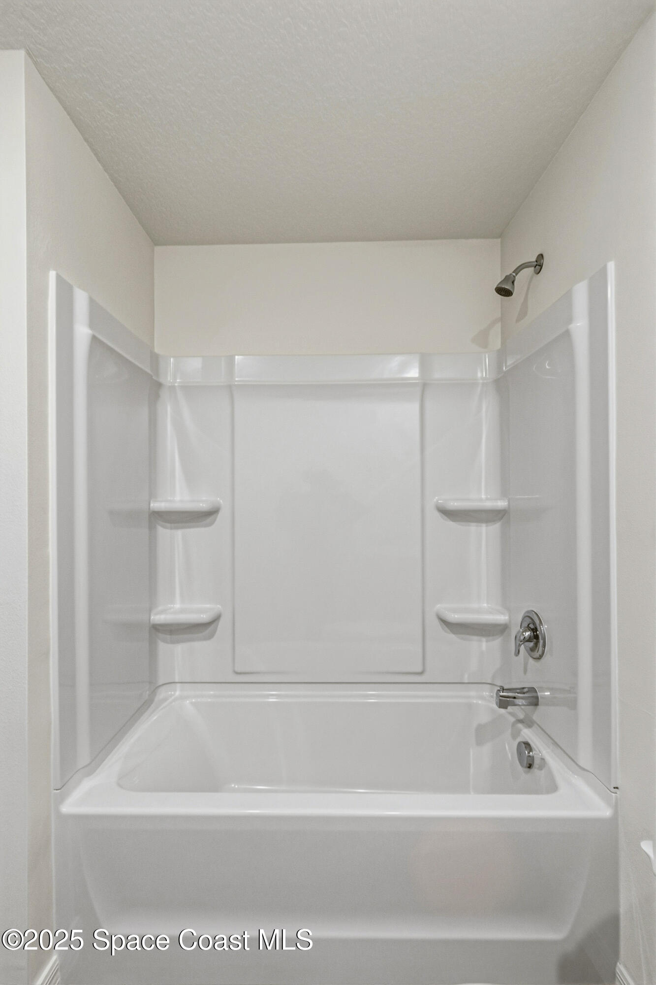 511 Trumpet Street Southwest Palm Bay, FL 32908 - Photo 21 of 43 a bathroom with a bathtub and a shower