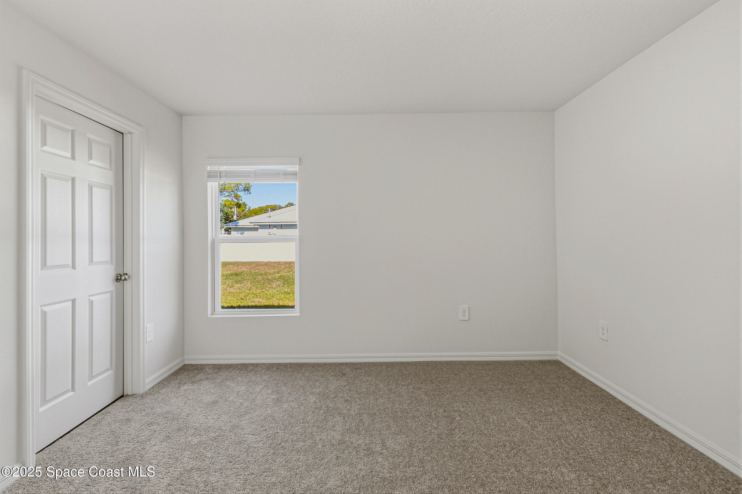 511 Trumpet Street Southwest Palm Bay, FL 32908 - Photo 24 of 43 an empty room with windows
