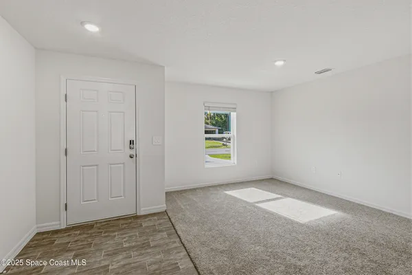 an empty room with windows