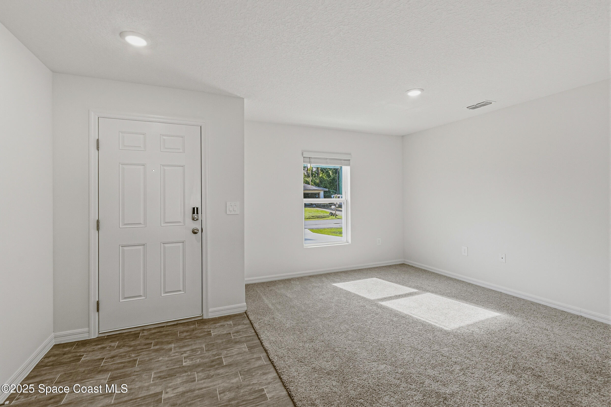 511 Trumpet Street Southwest Palm Bay, FL 32908 - Photo 27 of 43 an empty room with windows