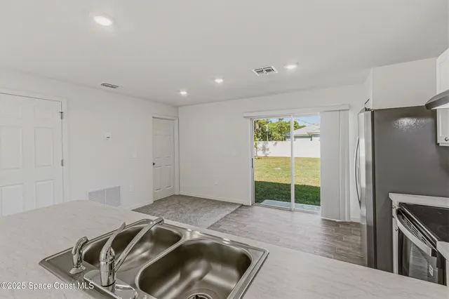 a view of a kitchen with a sink