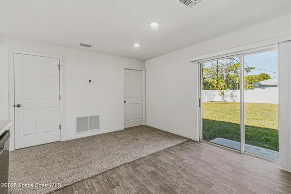 a view of an empty room with glass windows