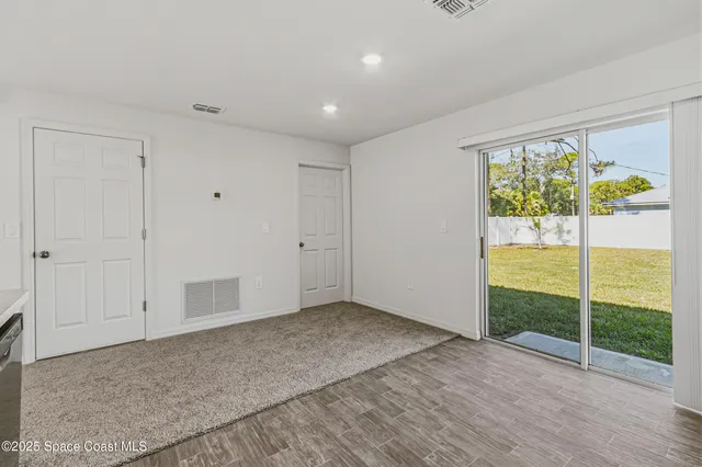 a kitchen with appliances a sink and cabinets