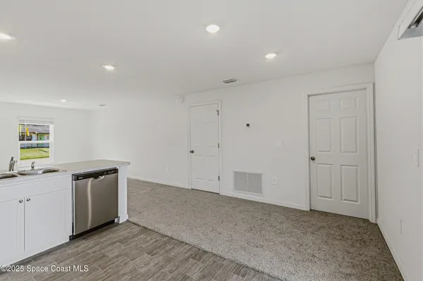a view of a kitchen with a sink