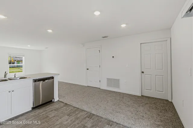 a view of an empty walk in closet