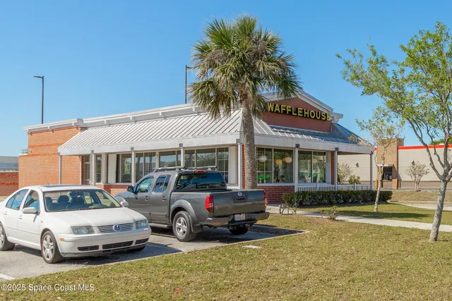a view of a water fountain and many windows