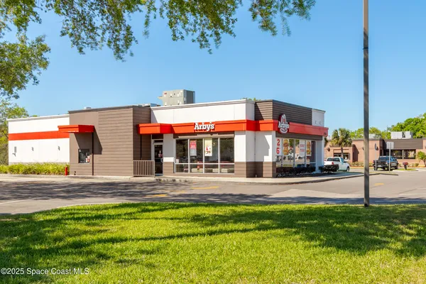 a view of a water fountain and many windows