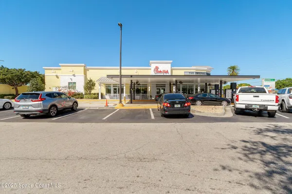 a view of cars parked in front of a building