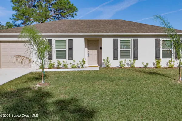 a house with garden in front of it
