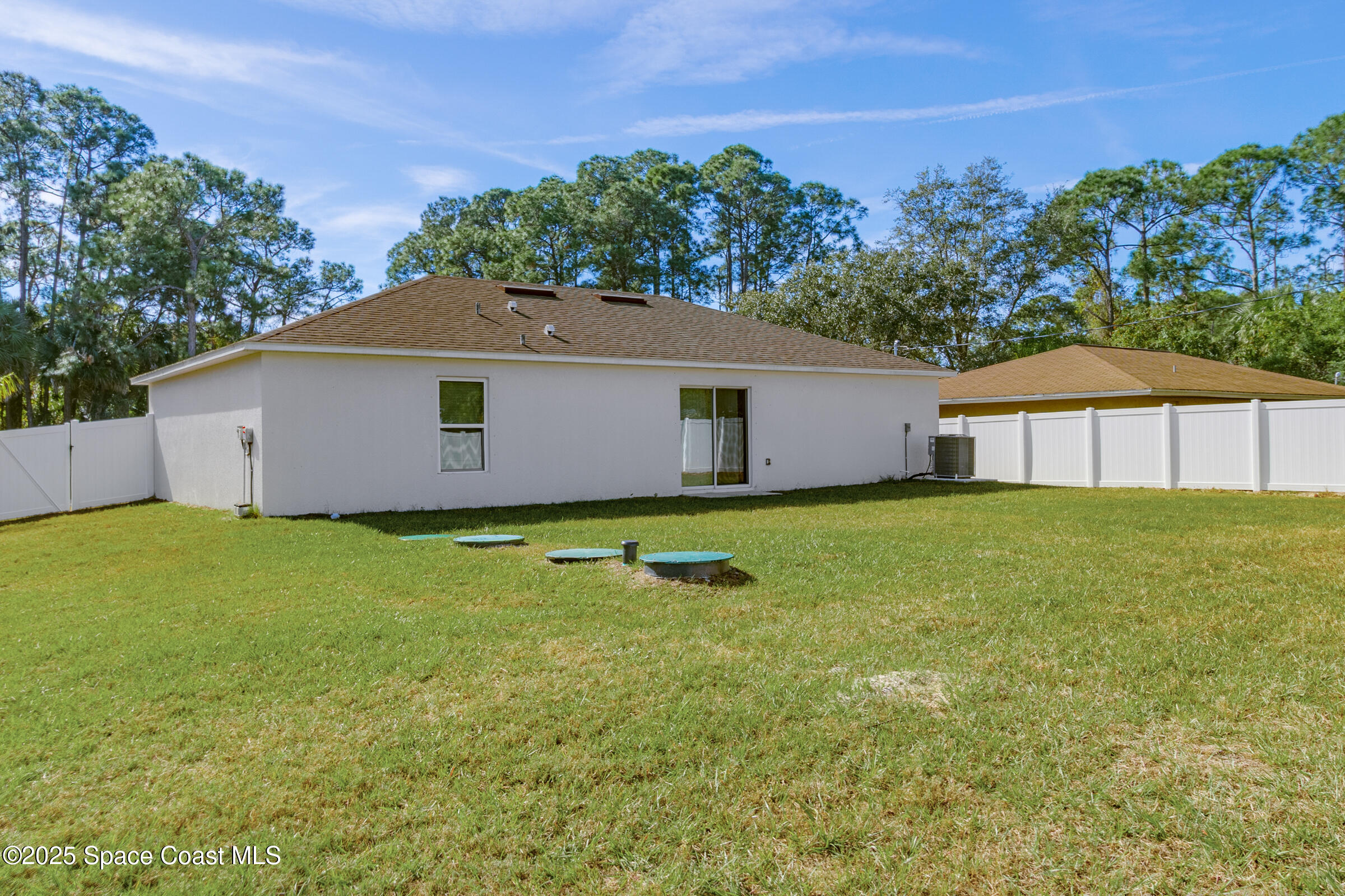 511 Trumpet Street Southwest Palm Bay, FL 32908 - Photo 7 of 43 a front view of house with yard and green space