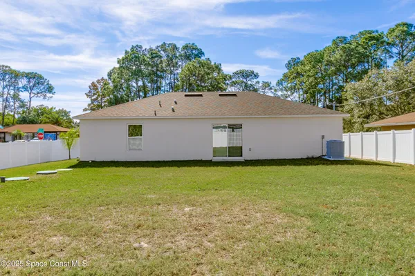 a backyard of a house with lots of green space
