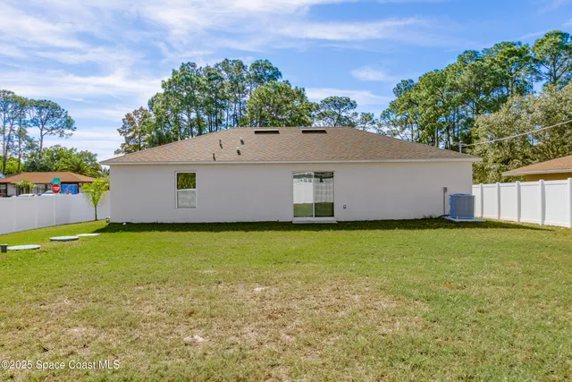 a backyard of a house with lots of green space