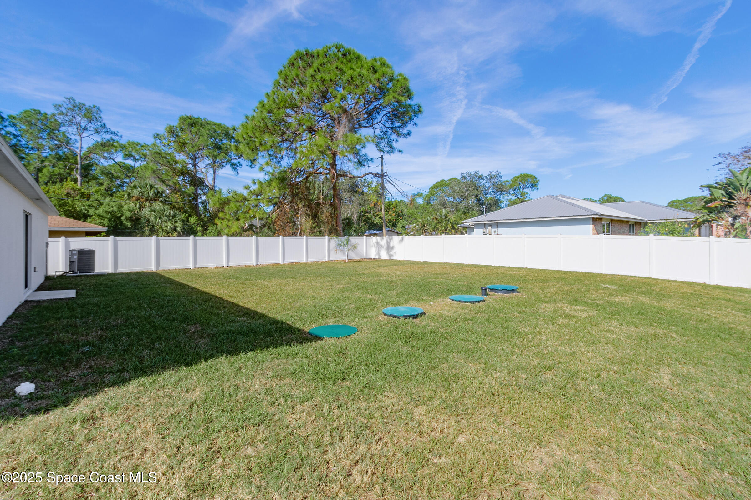 511 Trumpet Street Southwest Palm Bay, FL 32908 - Photo 10 of 43 a view of yard with swimming pool and green space