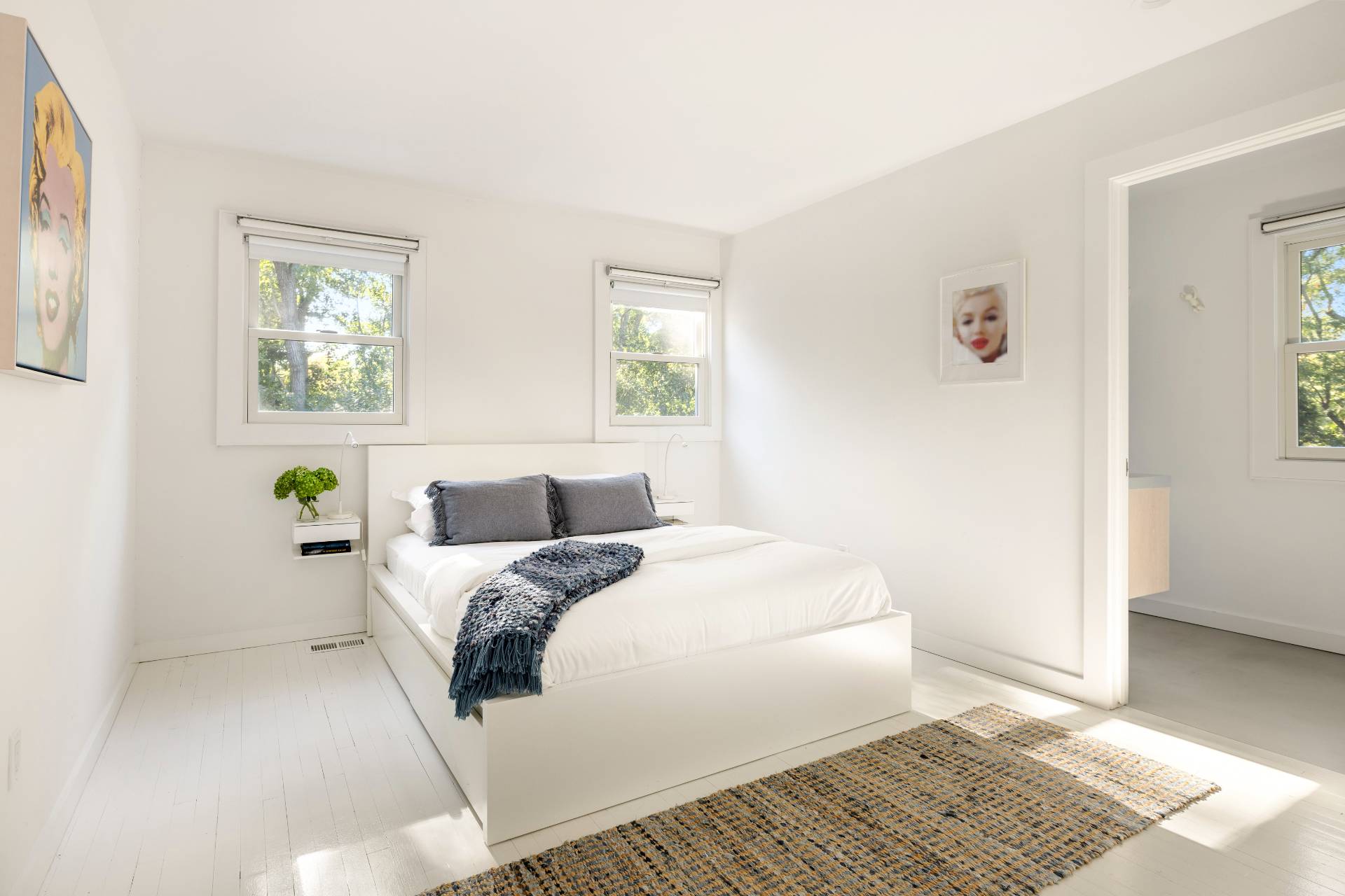 4108 Noyack Road Sag Harbor, NY 11963 - Photo 14 of 26 a bedroom with a bed and a window