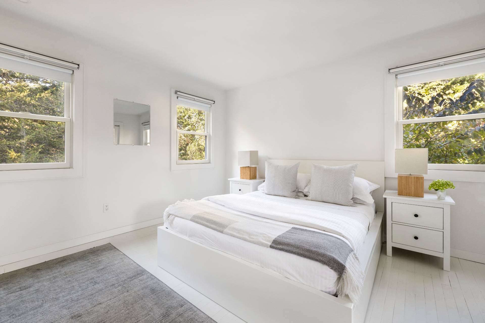 4108 Noyack Road Sag Harbor, NY 11963 - Photo 16 of 26 a bedroom with a bed and a window