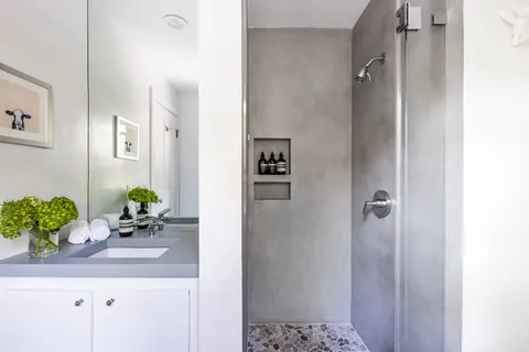 a bathroom with a sink a vanity and a mirror