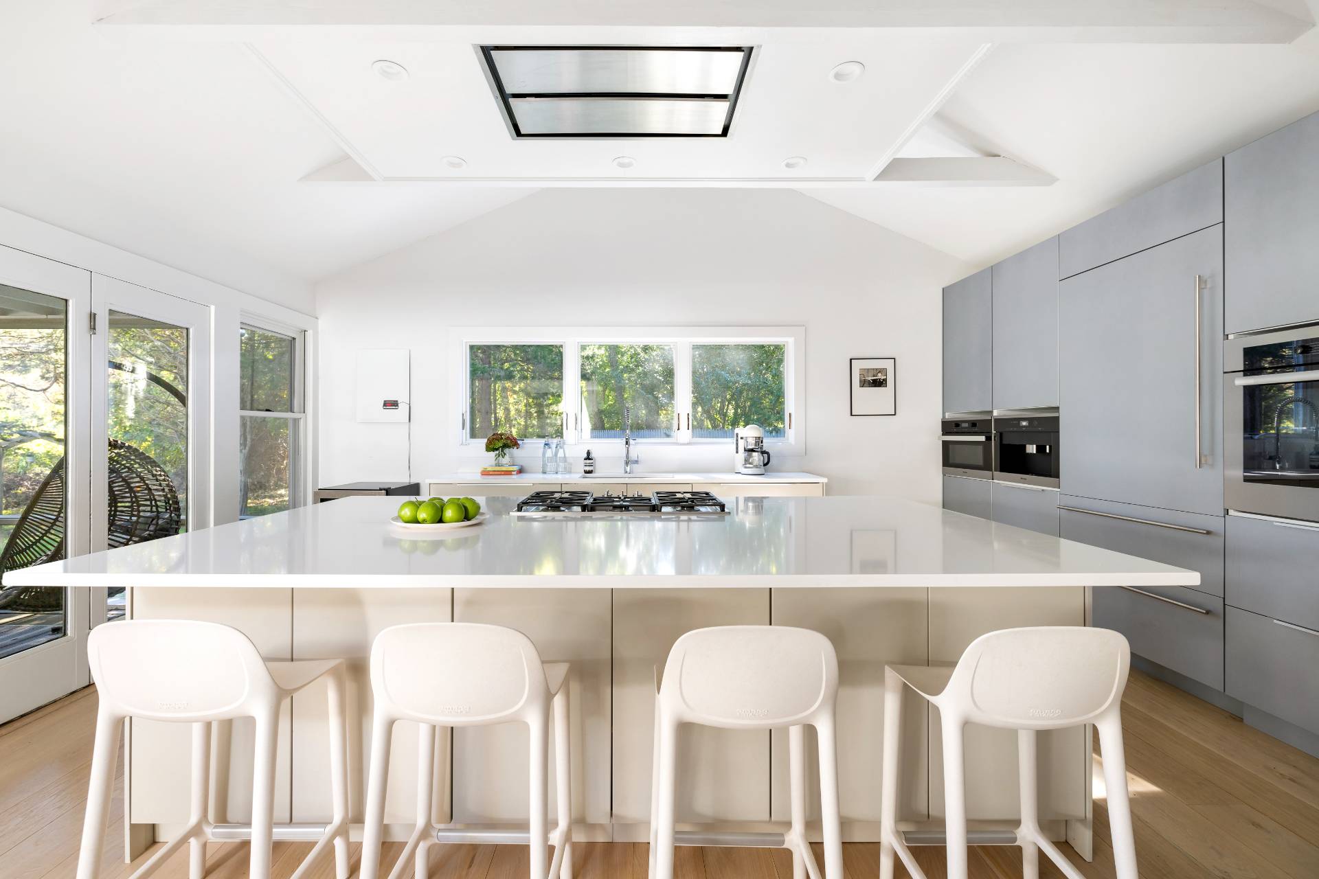 4108 Noyack Road Sag Harbor, NY 11963 - Photo 4 of 26 a view of a dining room with furniture and wooden floor