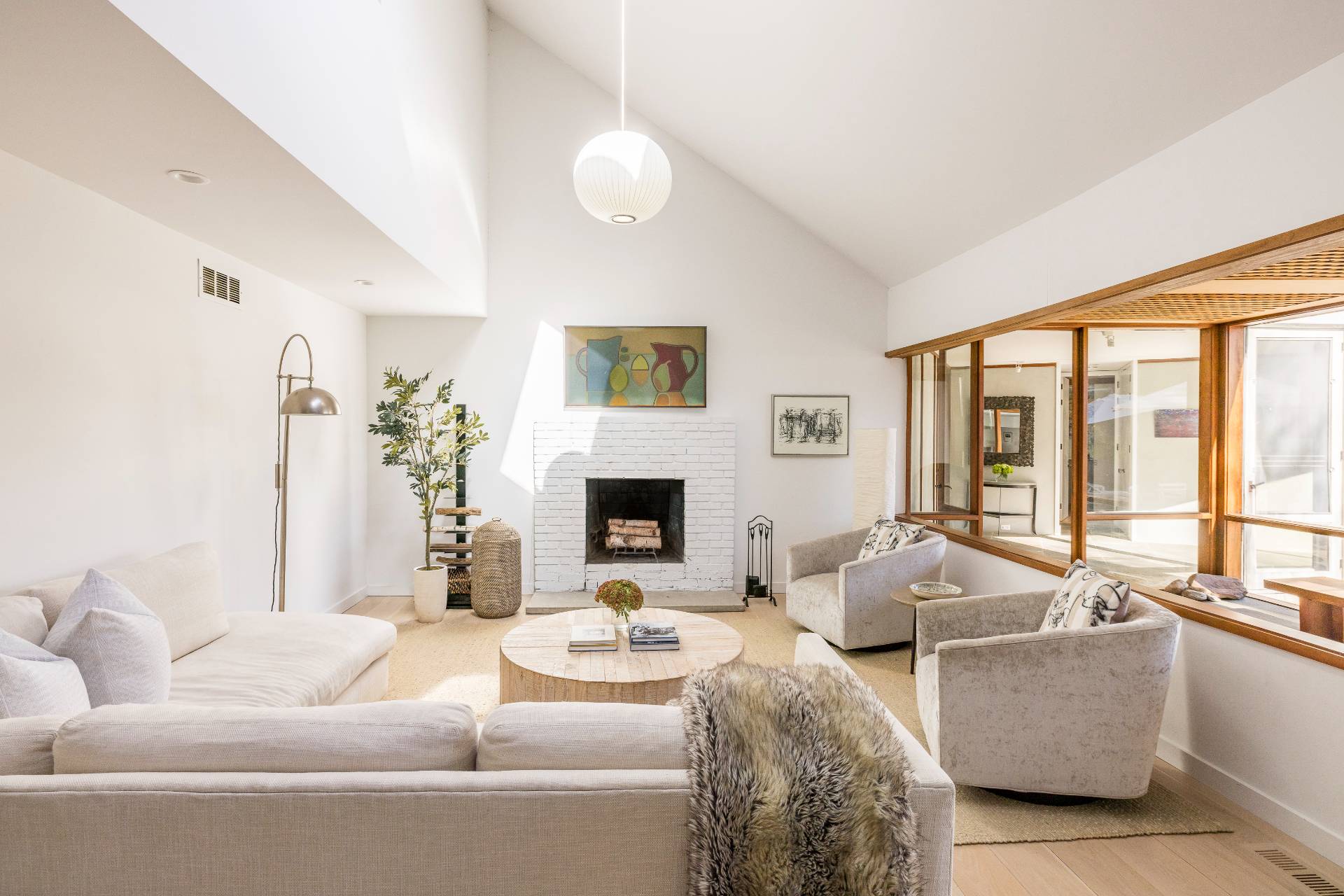 4108 Noyack Road Sag Harbor, NY 11963 - Photo 8 of 26 a living room with furniture and a large window