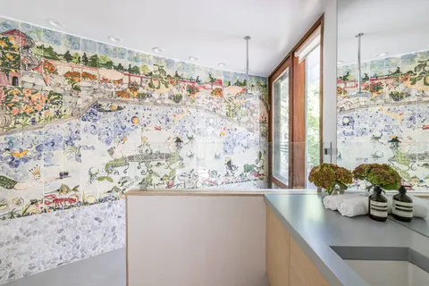 a view of bathroom with sink and mirror