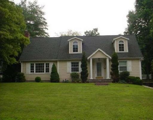 48 Crane Road Stamford, CT 06902 - Photo 1 of 1 a front view of a house with a yard