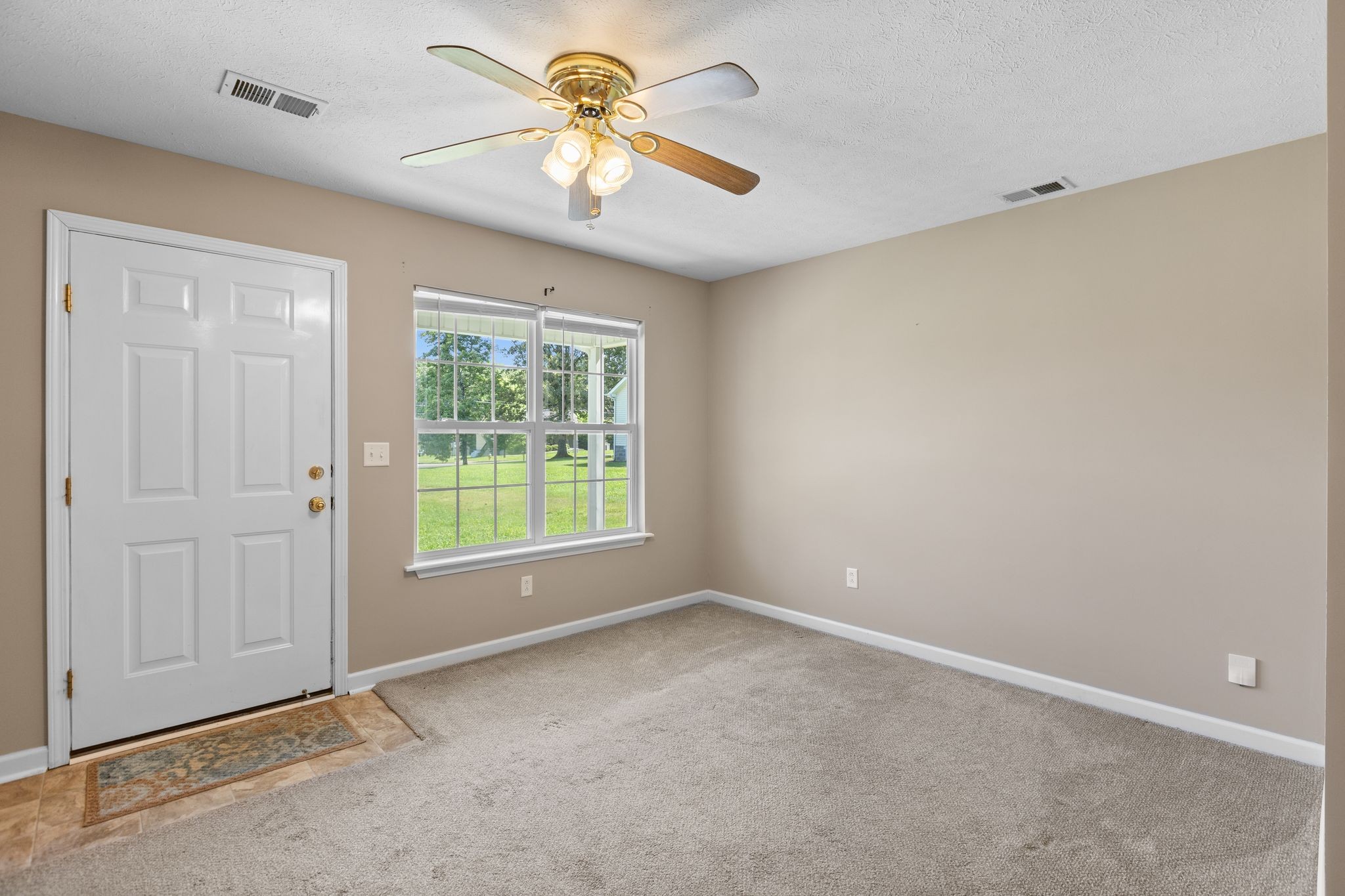 7215 Horn Tavern Road Fairview, TN 37062 - Photo 11 of 14 an empty room with windows and fan