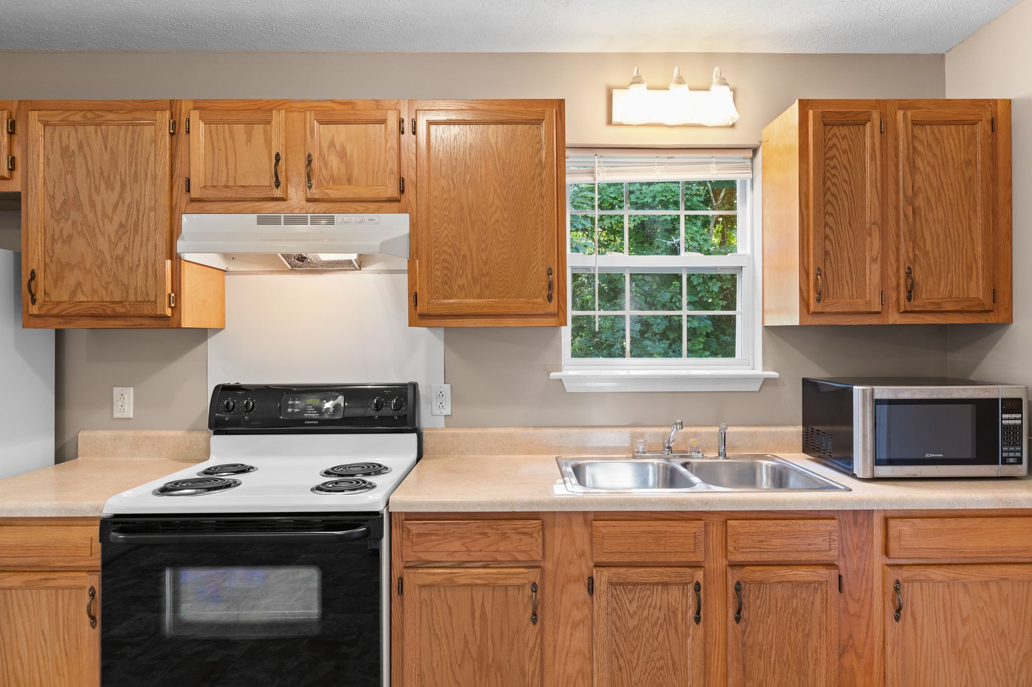 7215 Horn Tavern Road Fairview, TN 37062 - Photo 6 of 14 a kitchen with a stove and a microwave