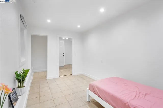 a spacious bedroom with a bed and furniture