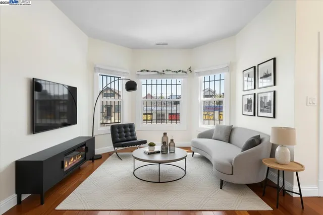 a bedroom with a bed and a painting on the wall