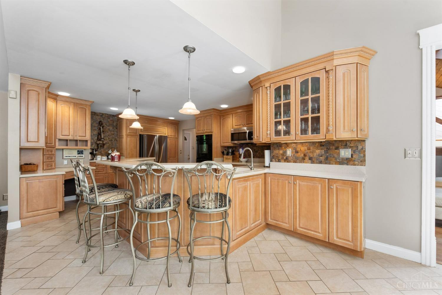 524 Chapel Road Amelia, OH 45102 - Photo 20 of 56 Lots of storage in this beautiful cabinetry, extra seating at the counterbar too.