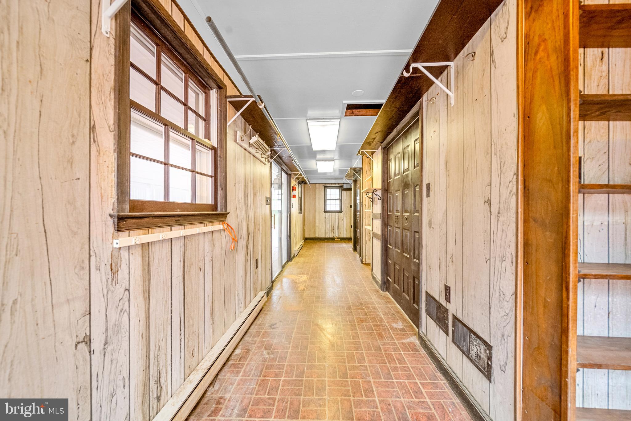 18189 Sands Road Purcellville, VA 20132 - Photo 75 of 145 Enclosed breezeway with storage access.