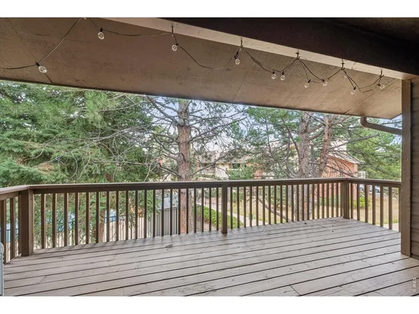 a view of balcony with wooden floor