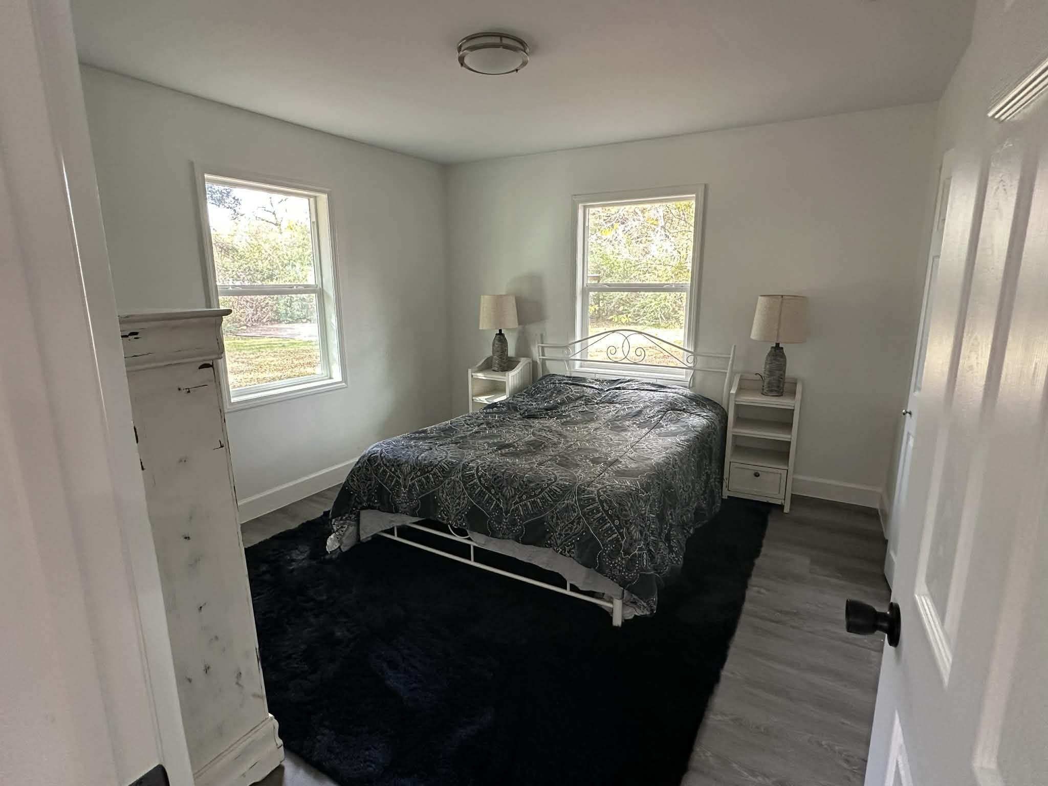 614 Fm 1406 Road Winnie, TX 77665 - Photo 13 of 19 a bedroom with a bed next to a window