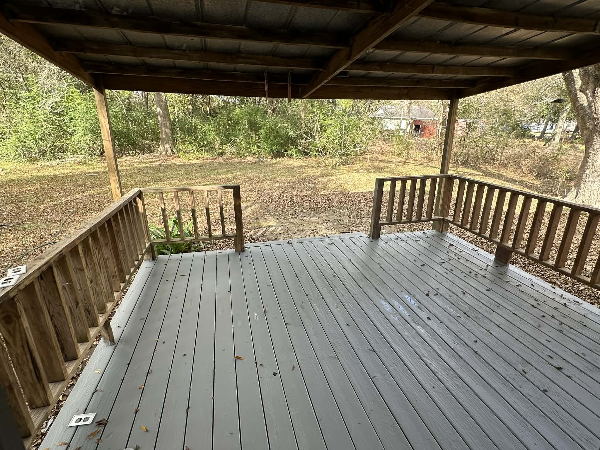 614 Fm 1406 Road Winnie, TX 77665 - Photo 15 of 19 a view of balcony with wooden floor