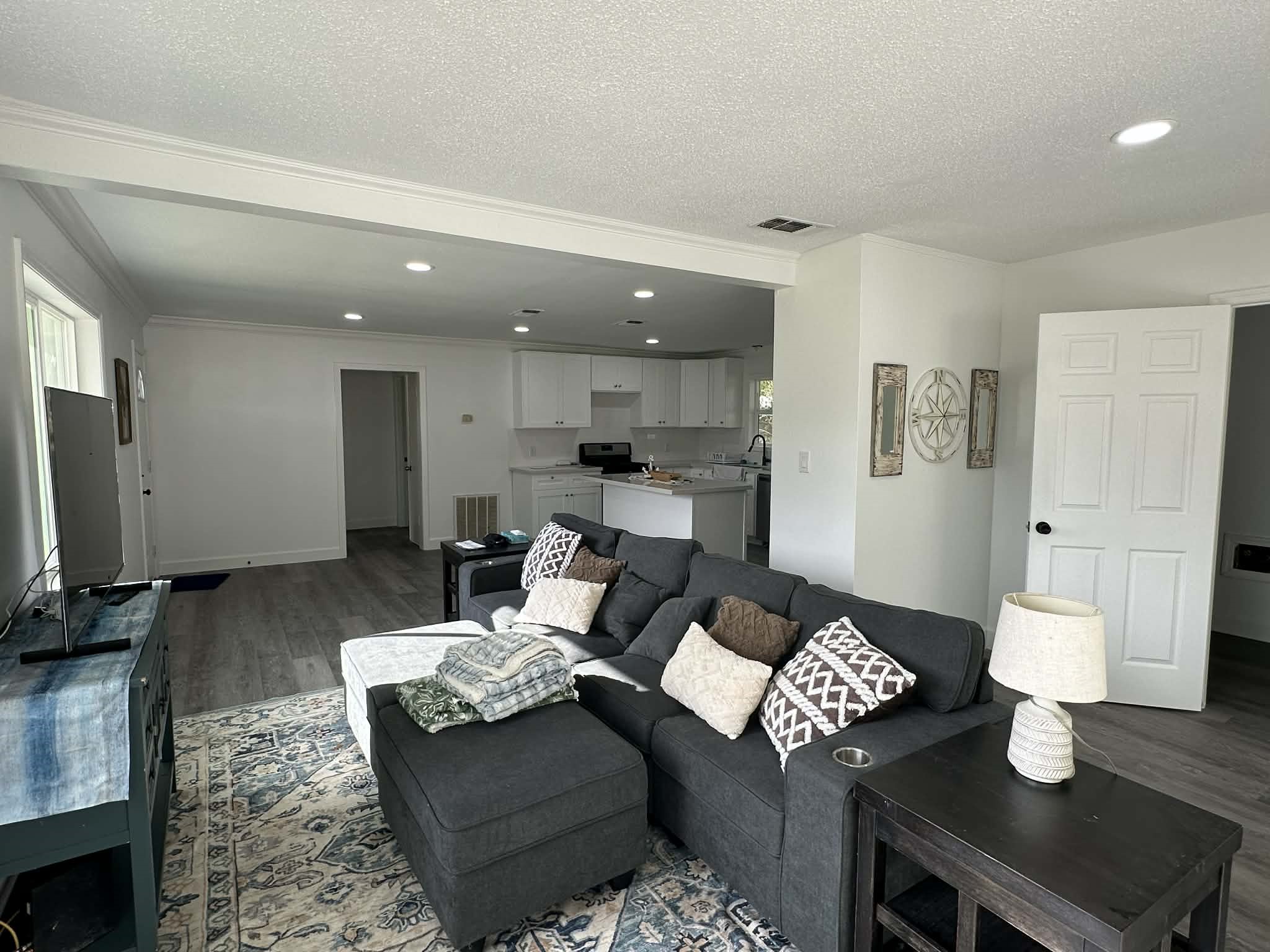 614 Fm 1406 Road Winnie, TX 77665 - Photo 6 of 19 a living room with furniture and a flat screen tv