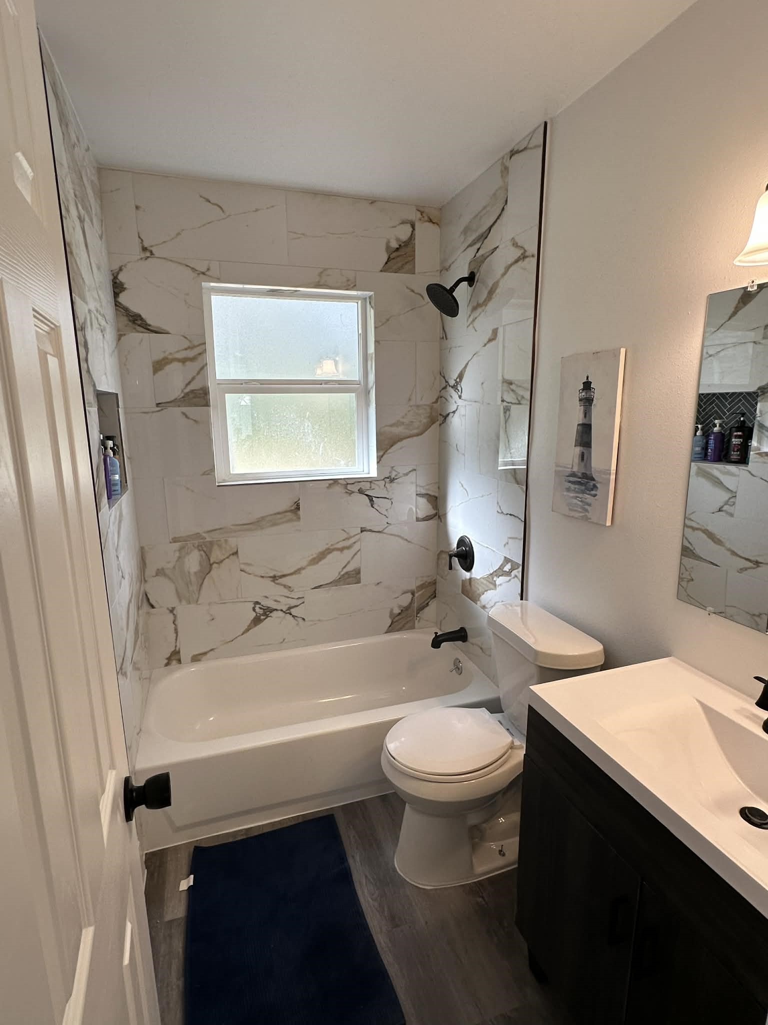 614 Fm 1406 Road Winnie, TX 77665 - Photo 10 of 19 a bathroom with a sink a toilet a mirror and shower