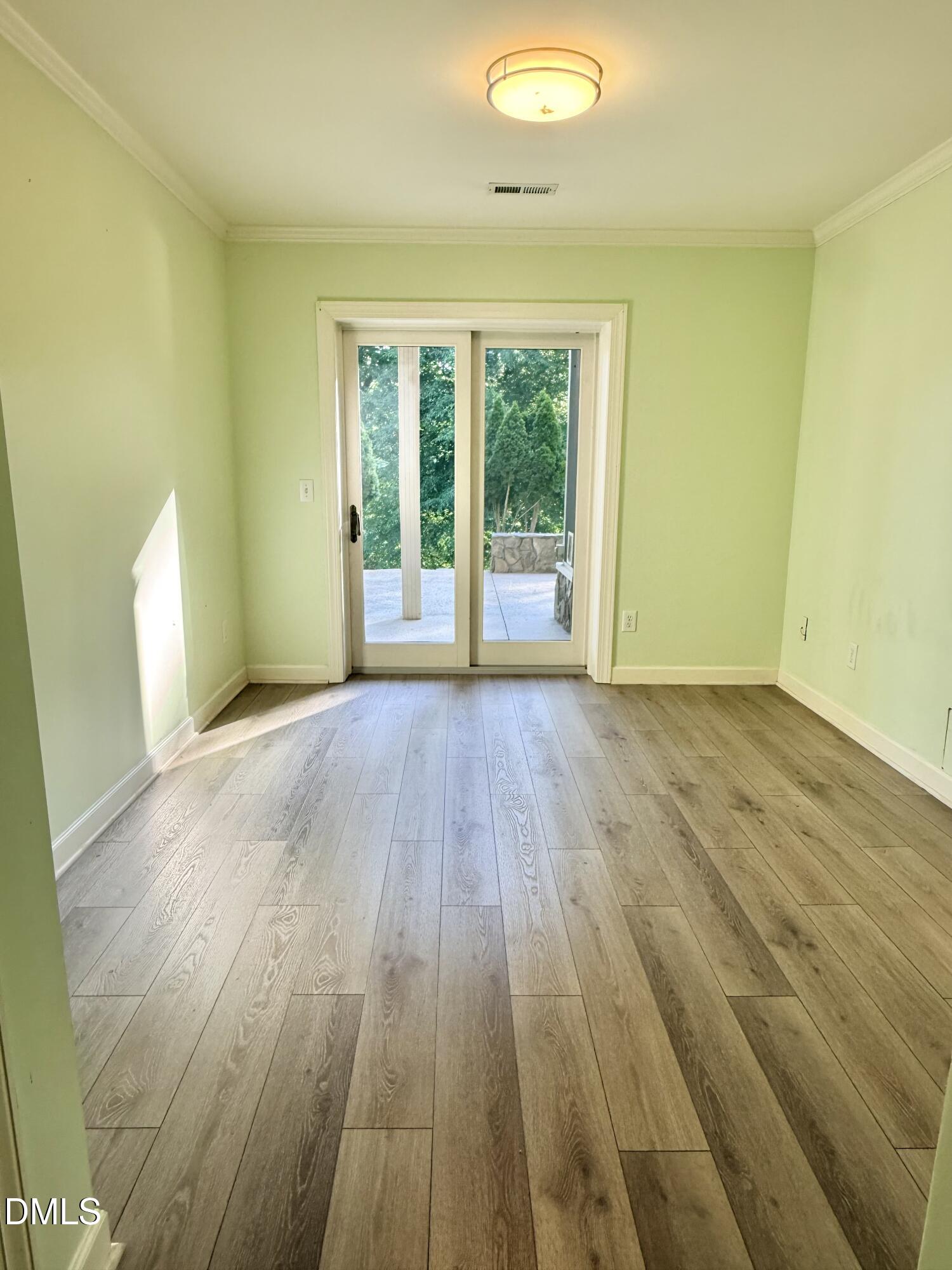 81 Beaver Crossing Road Roxboro, NC 27574 - Photo 34 of 80 a view of a room with wooden floor and sliding window
