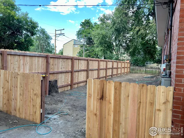 a view of a wooden fence
