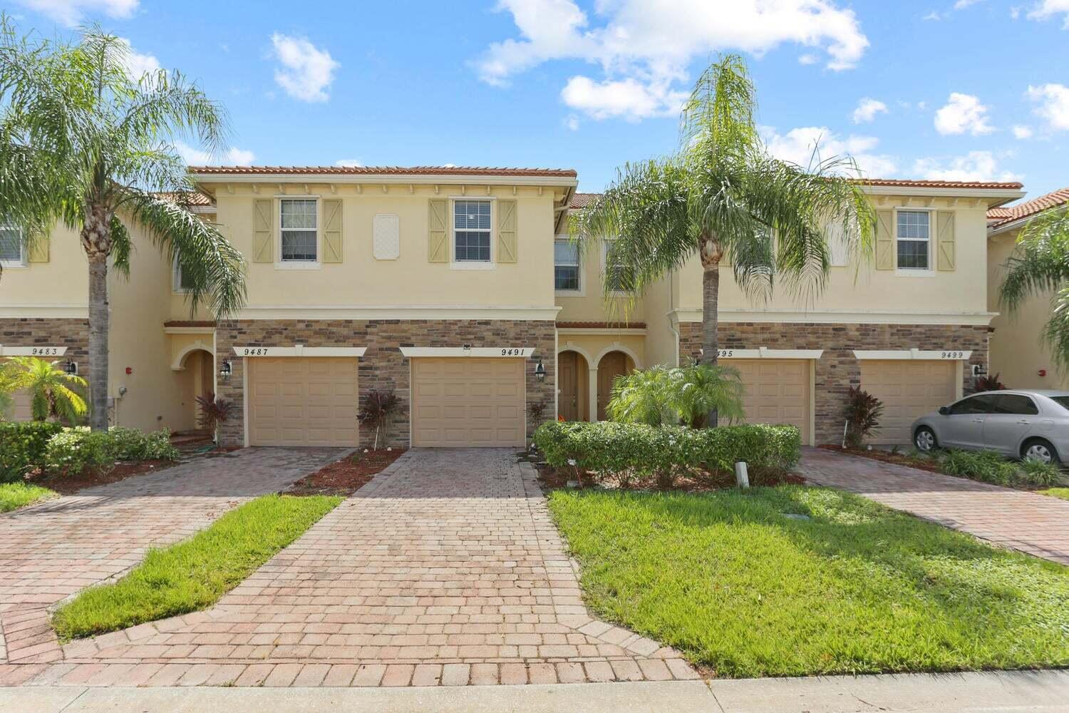 9491 Southwest Merlin Court Stuart, FL 34997 - Photo 2 of 44 Garage