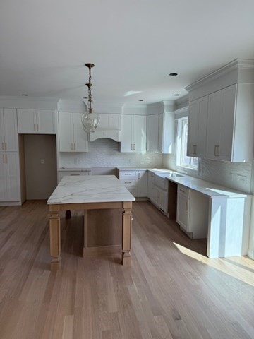 Lot 7 Muriel Way Rehoboth, MA 02769 - Photo 11 of 28 a kitchen with cabinets wooden floor and stainless steel appliances